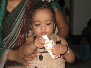 A child playing with the deworming medicine